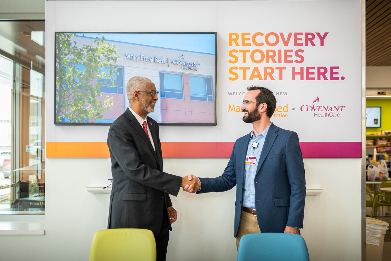 two men shaking hands